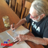 Farm Aid Grants: Keeping Family Farmers on the Land Willie Nelson, Farm Aid President, signs 2019 grant checks.